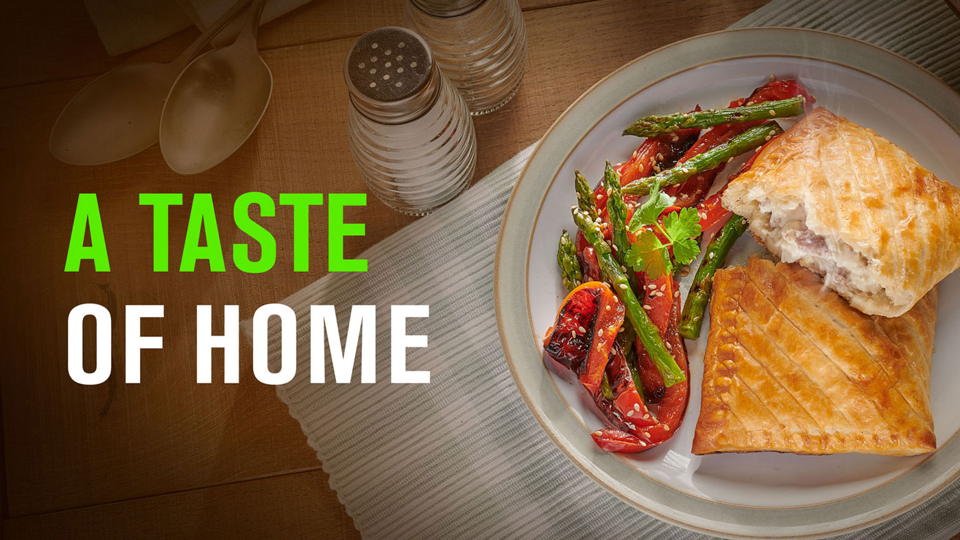 A taste of home message appearing over an image of a savoury slice