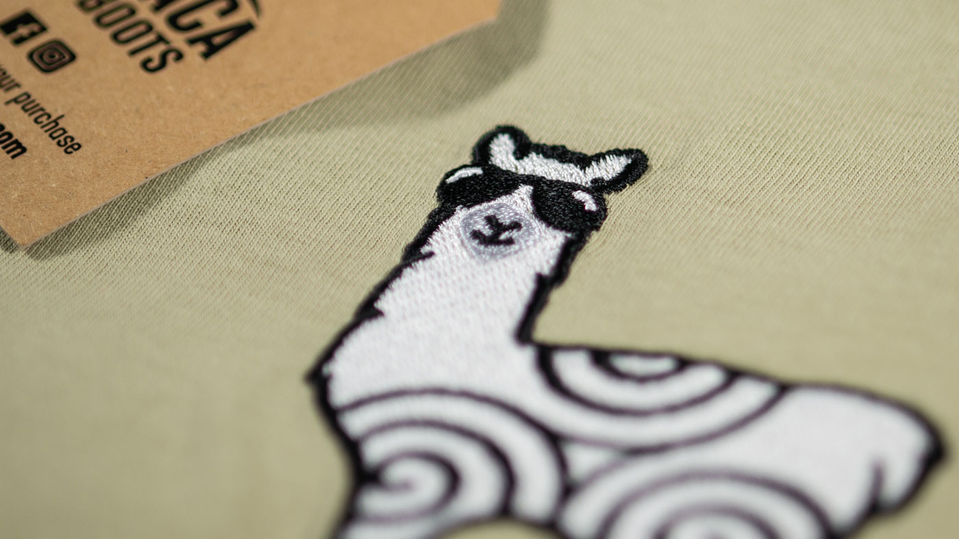 Closeup of Alpaca My Boots embroided t-shirt showing character detail