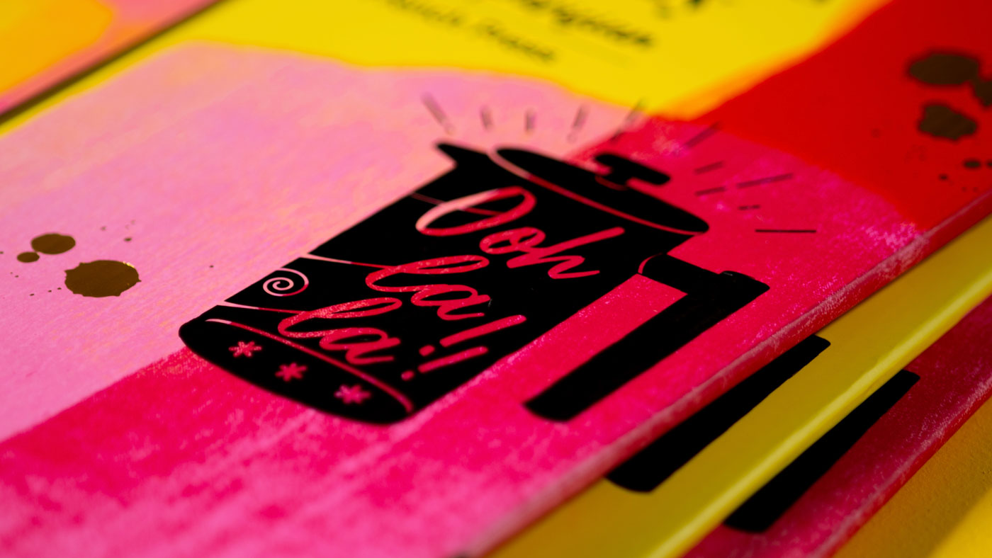 Closeup detail of packaging showing bold french press illustration