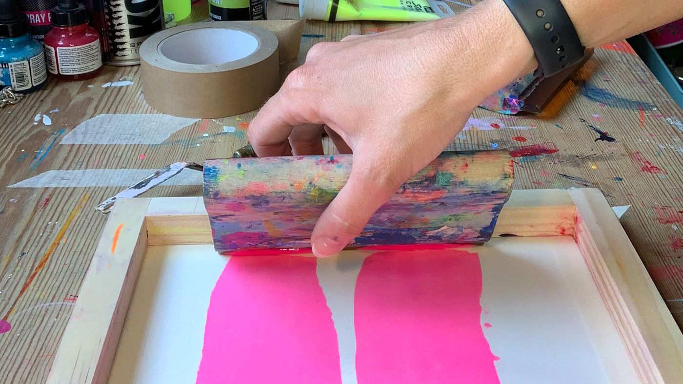 Closeup of Emma screen printing in her studio
