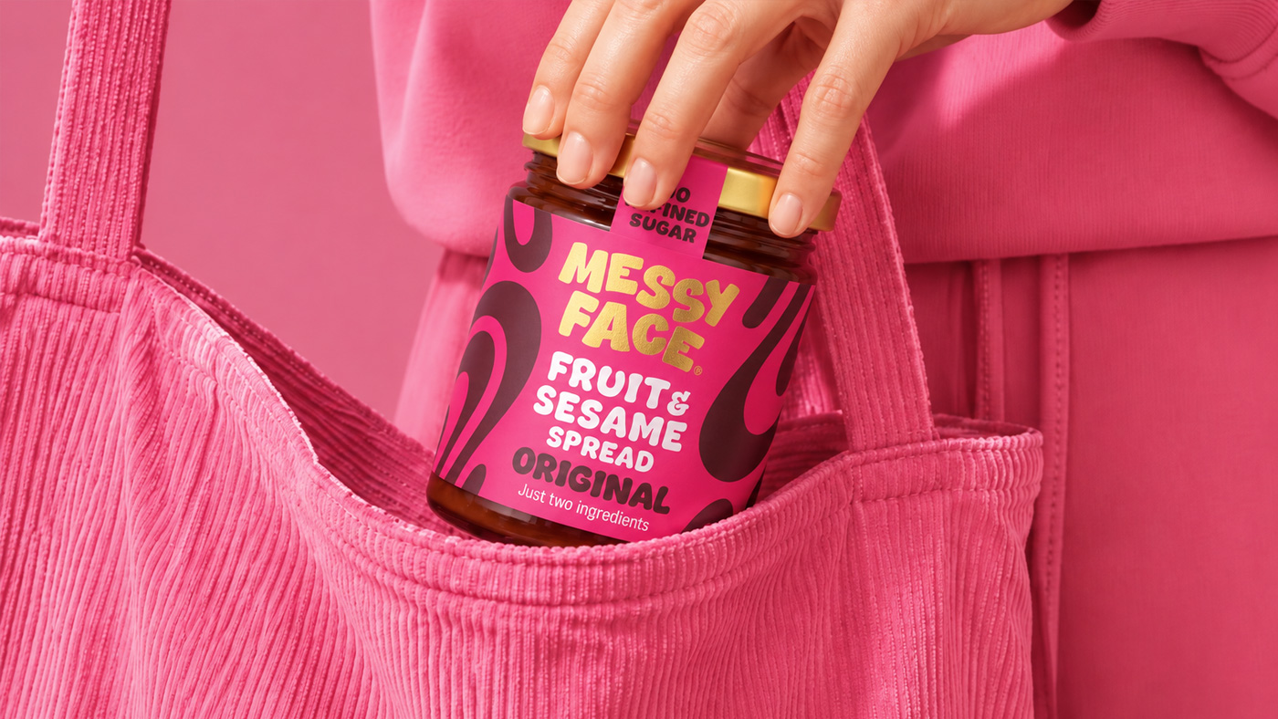 Image of MessyFace Jar being placed in bag